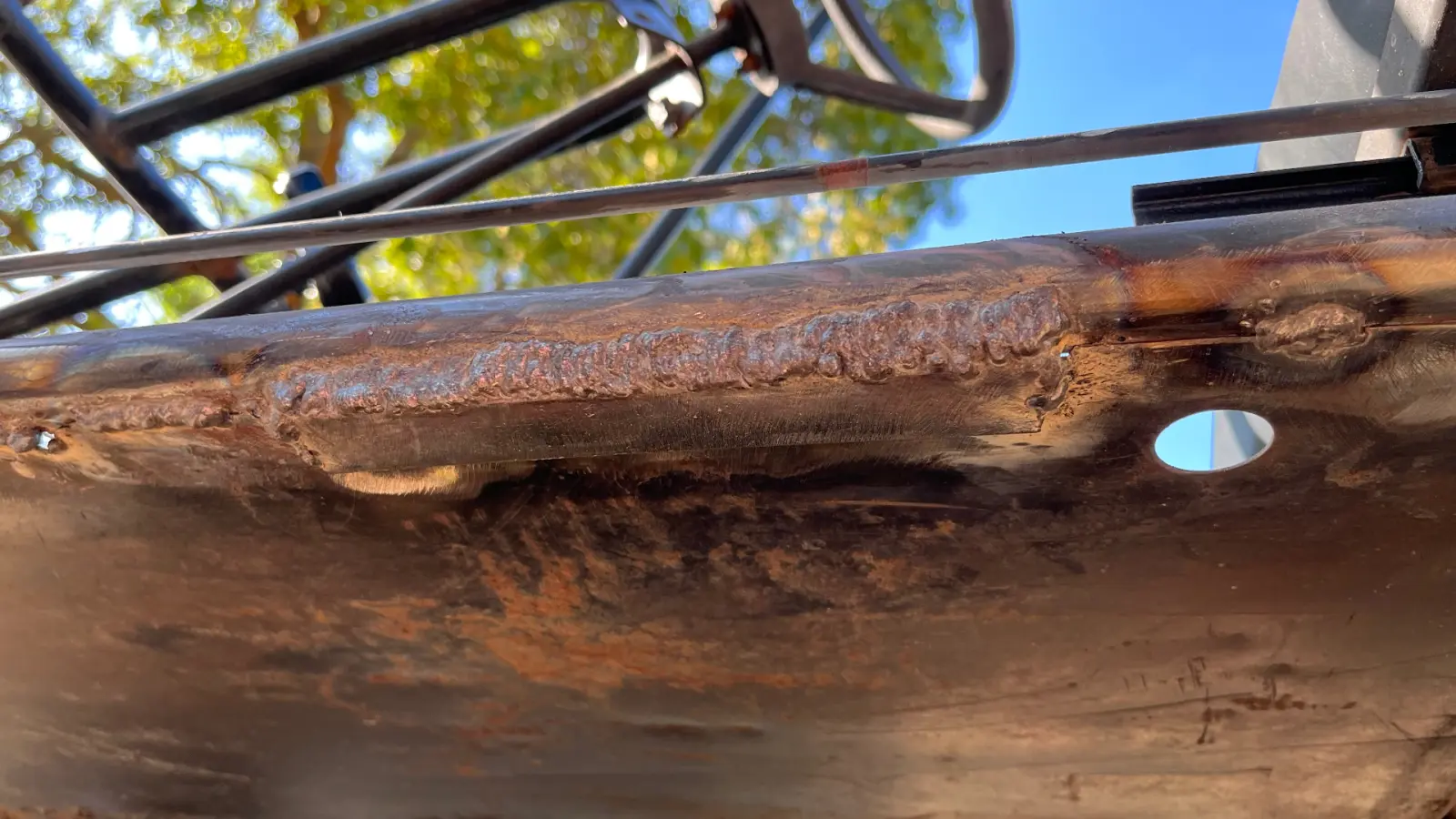 Stacked dime stick weld bead along a buggy frame rail